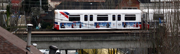 An eastbound Mark I series train leaves New Westminster station